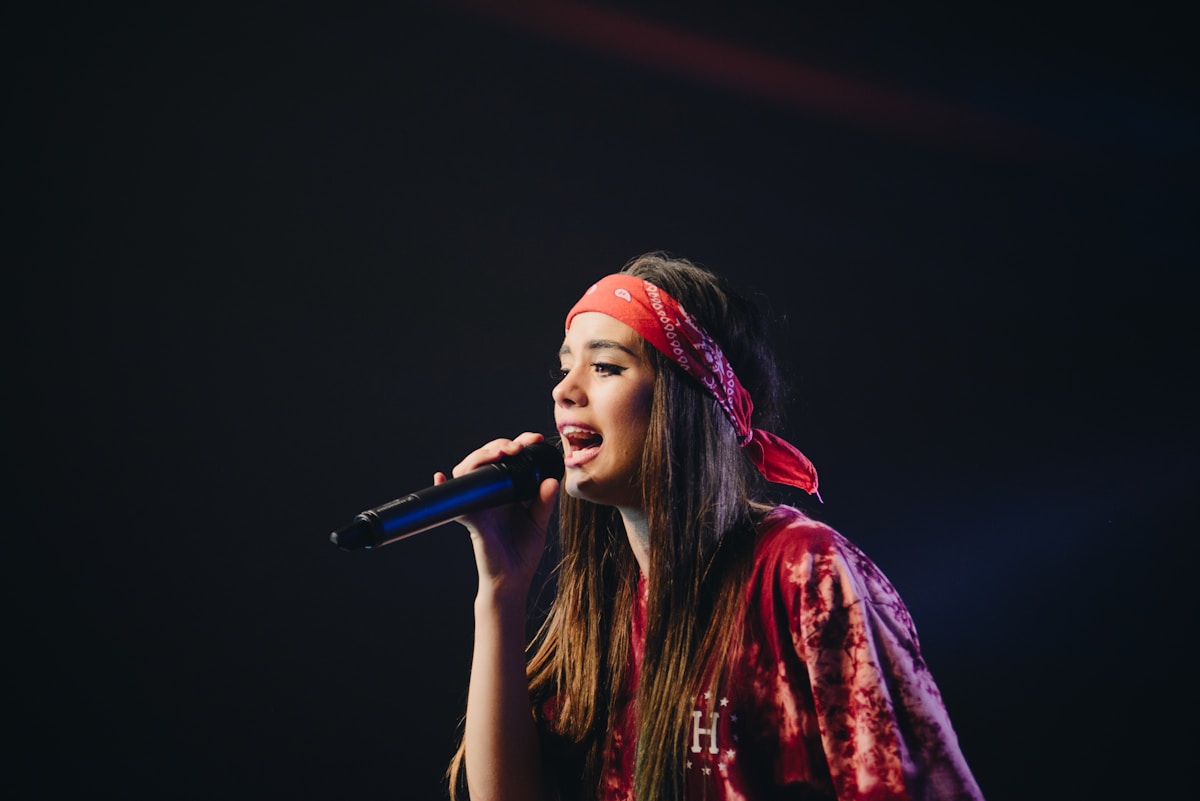 Artist singing into a microphone